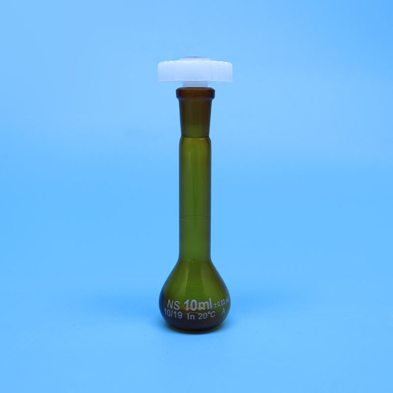 Laboratory brown glass volumetric flask with plastic stopper