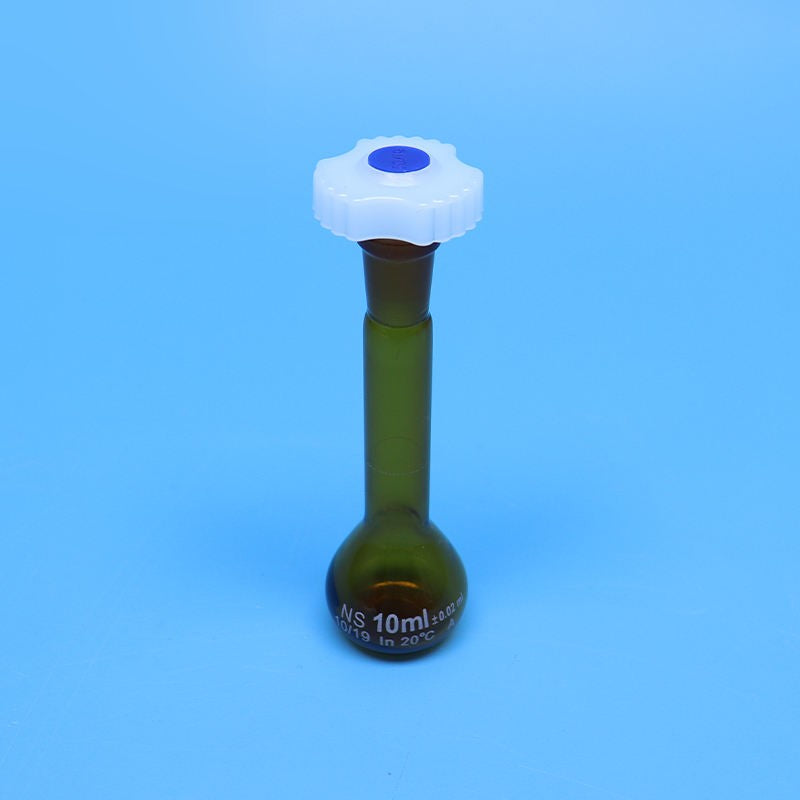 Laboratory brown glass volumetric flask with plastic stopper
