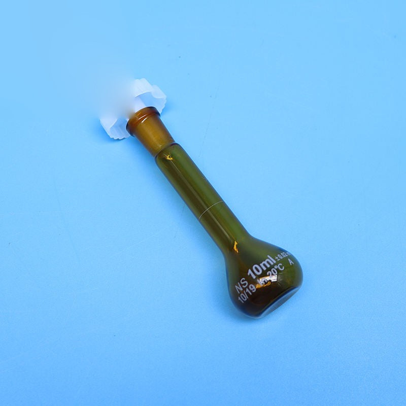 Laboratory brown glass volumetric flask with plastic stopper
