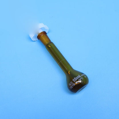 Laboratory brown glass volumetric flask with plastic stopper