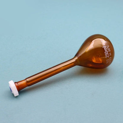 Volumetric flask with plastic stopper