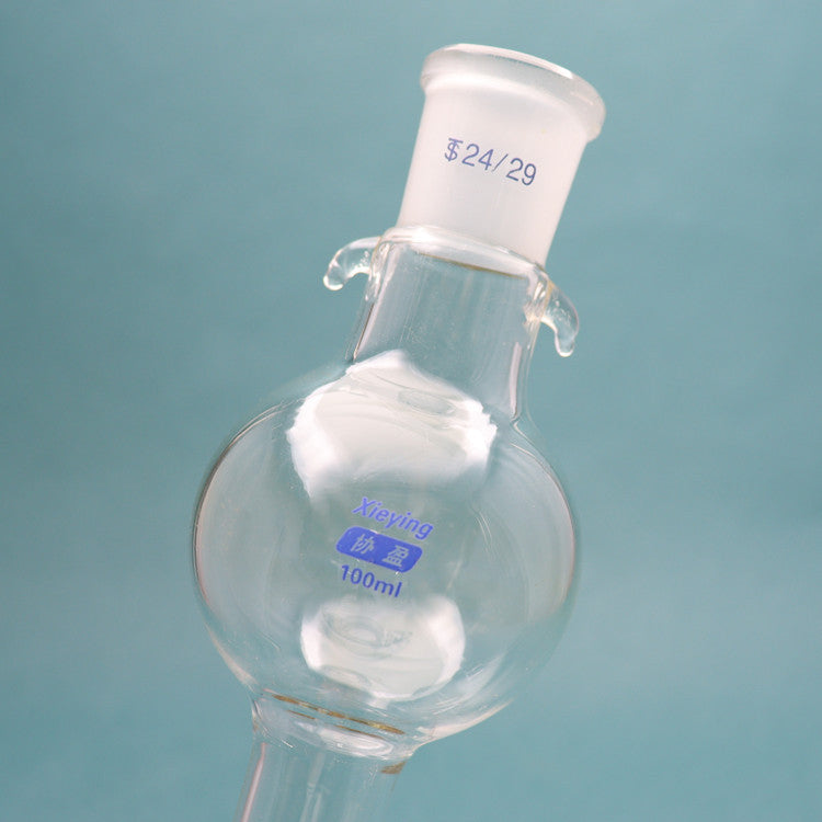 Glass chromatographic column with storage/reservoir ball and PTFE piston for flash chromatography
