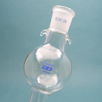 Glass chromatographic column with storage/reservoir ball and PTFE piston for flash chromatography