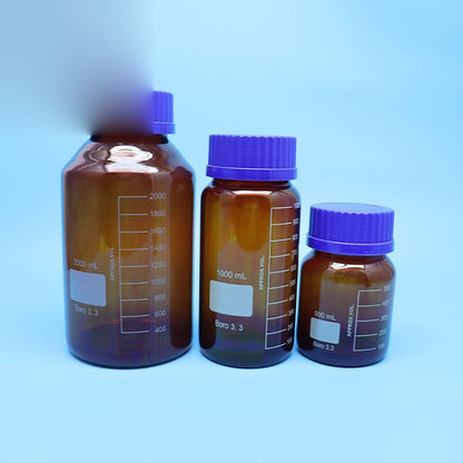 Amber borosilicate glass reagent bottle with blue screw cap