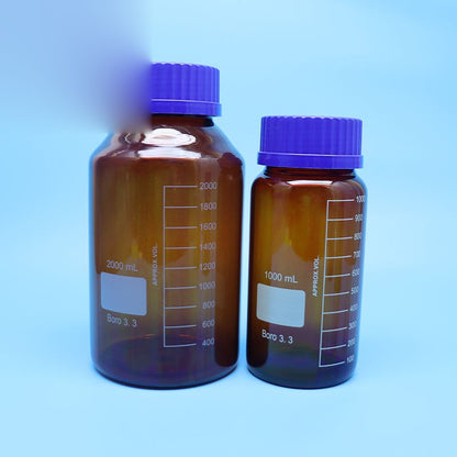 Amber borosilicate glass reagent bottle with blue screw cap