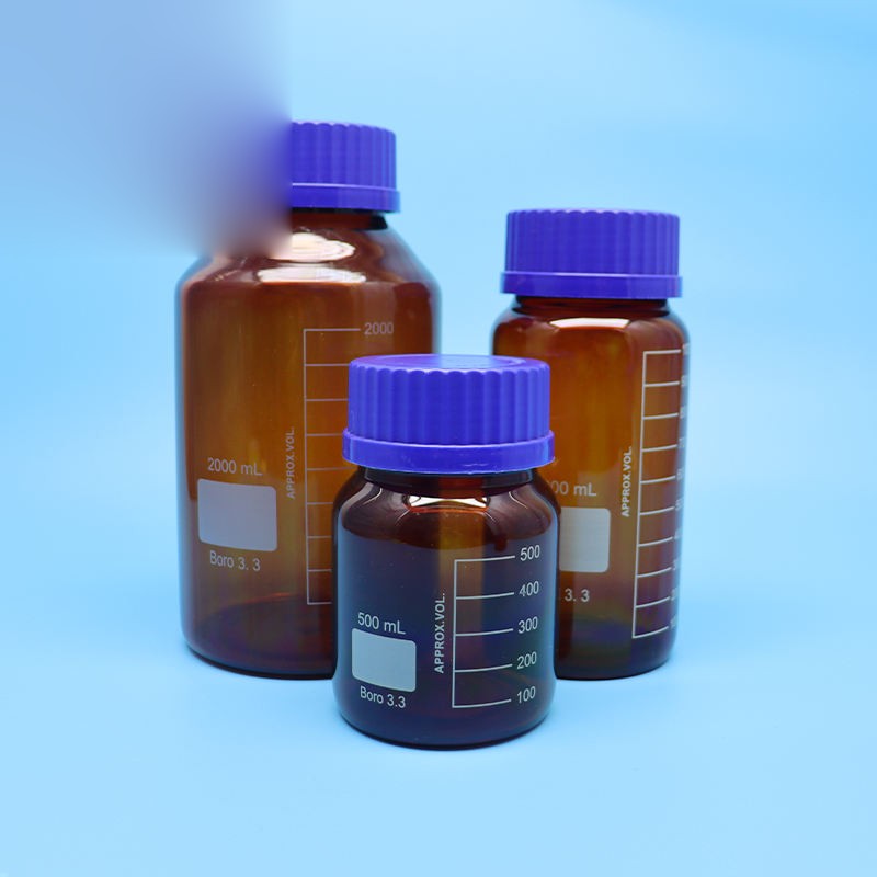 Amber borosilicate glass reagent bottle with blue screw cap