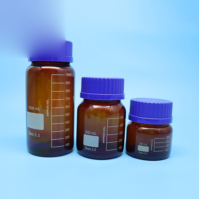 Amber borosilicate glass reagent bottle with blue screw cap