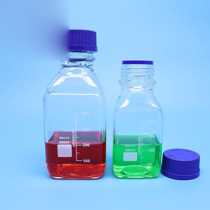 Square borosilicate glass reagent vial with blue screw cap and graduation marks