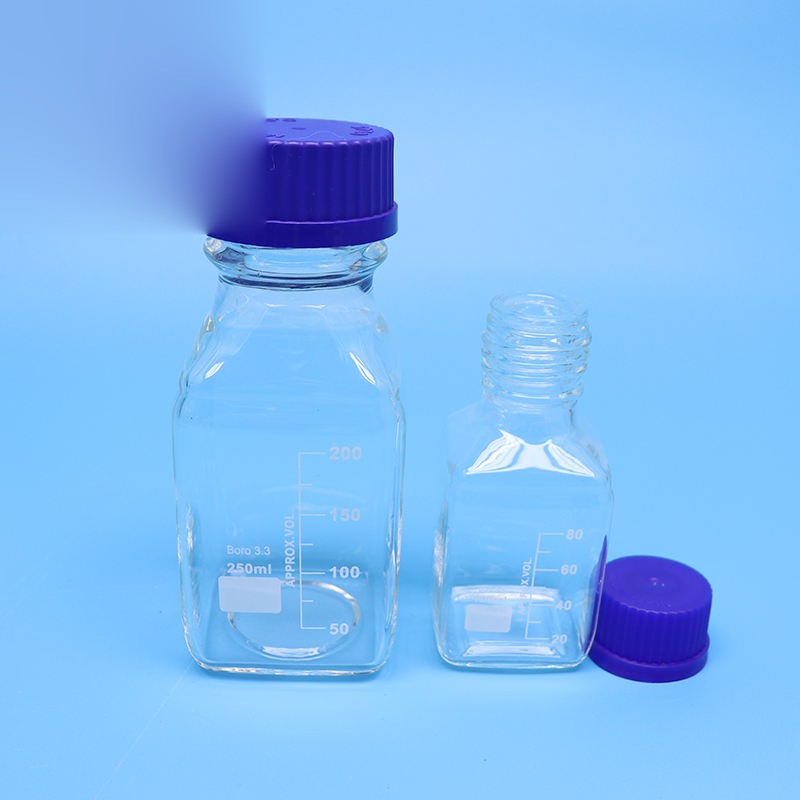 Square wide-mouth borosilicate glass reagent bottle with blue screw cap